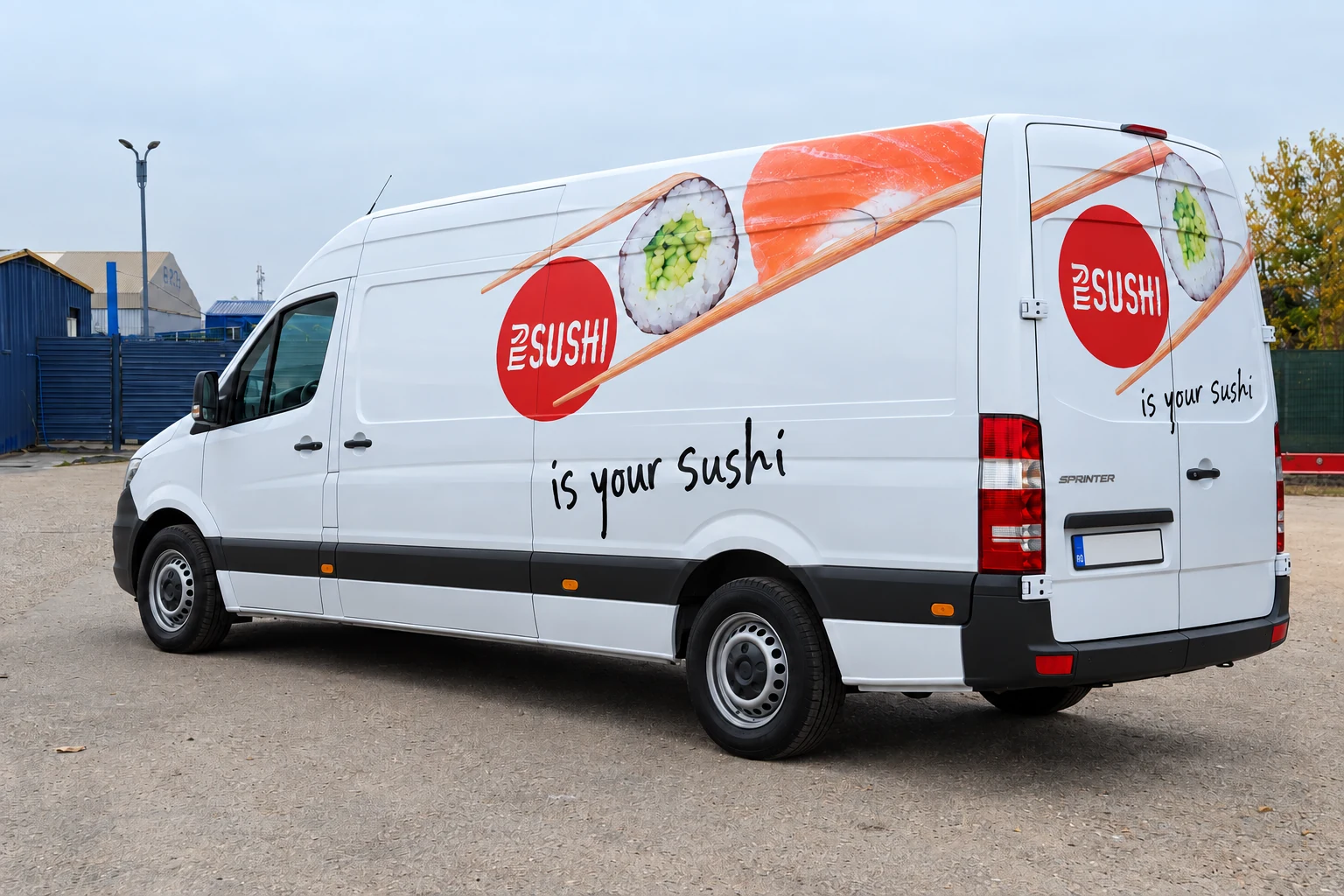 Large MY SUSHI van with sushi graphics in an industrial setting